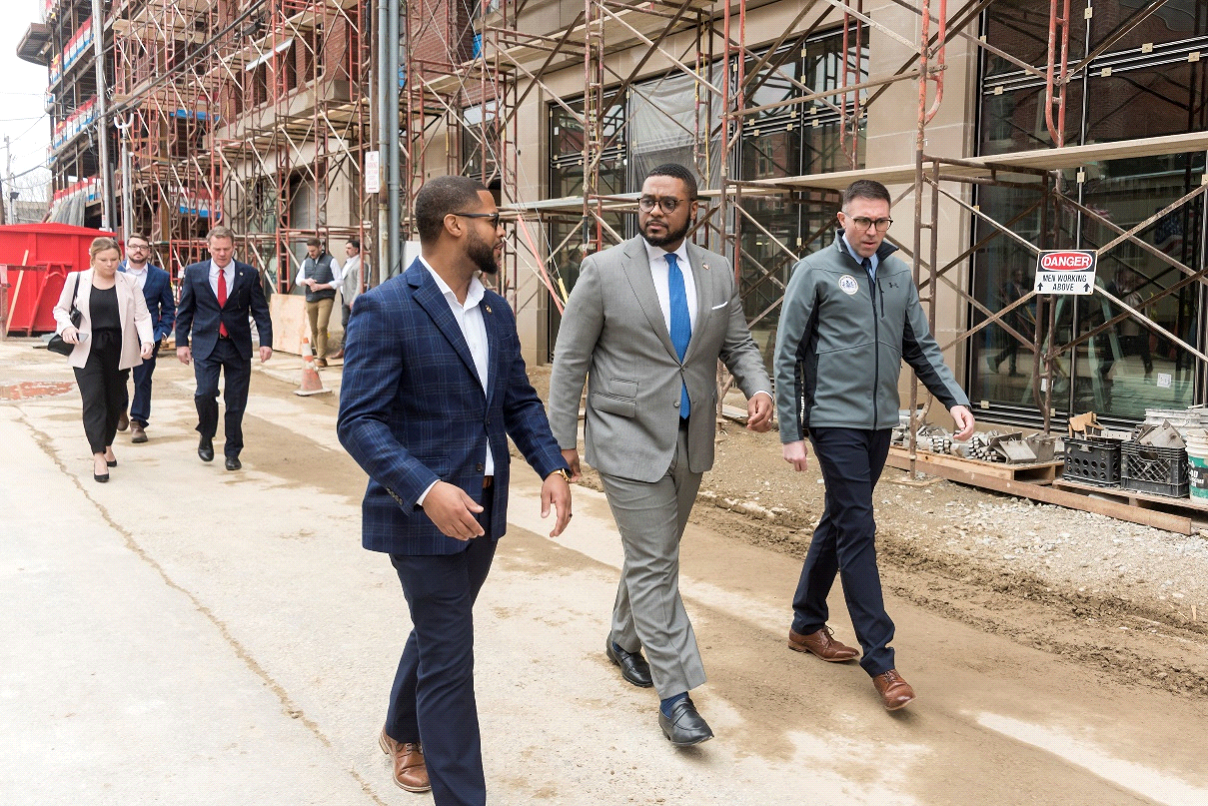 Erie Downtown Development Corporation Director of Operations and Logistics Corey Cook, Lt. Gov. Austin Davis and state Rep. Ryan Bizzarro tour downtown Erie